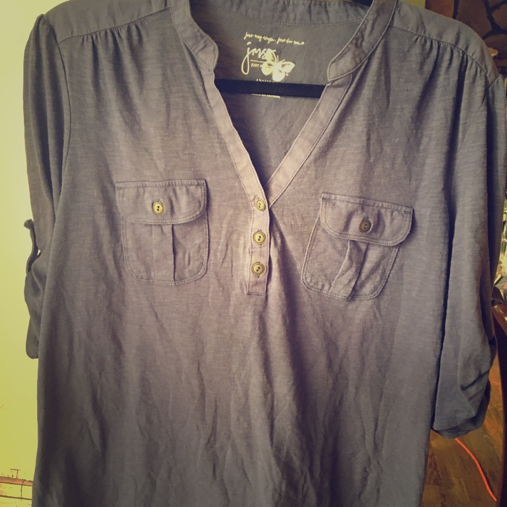 Soft blue blouse with pockets.